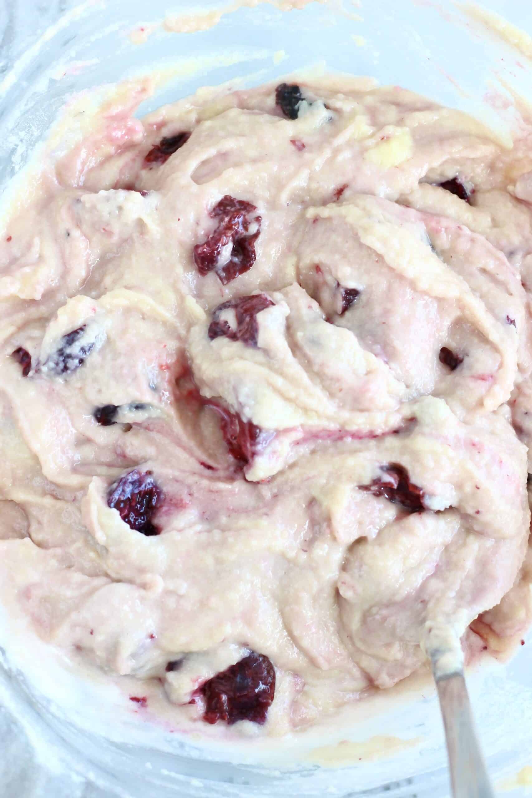 Raw gluten-free vegan cherry cake batter in a mixing bowl