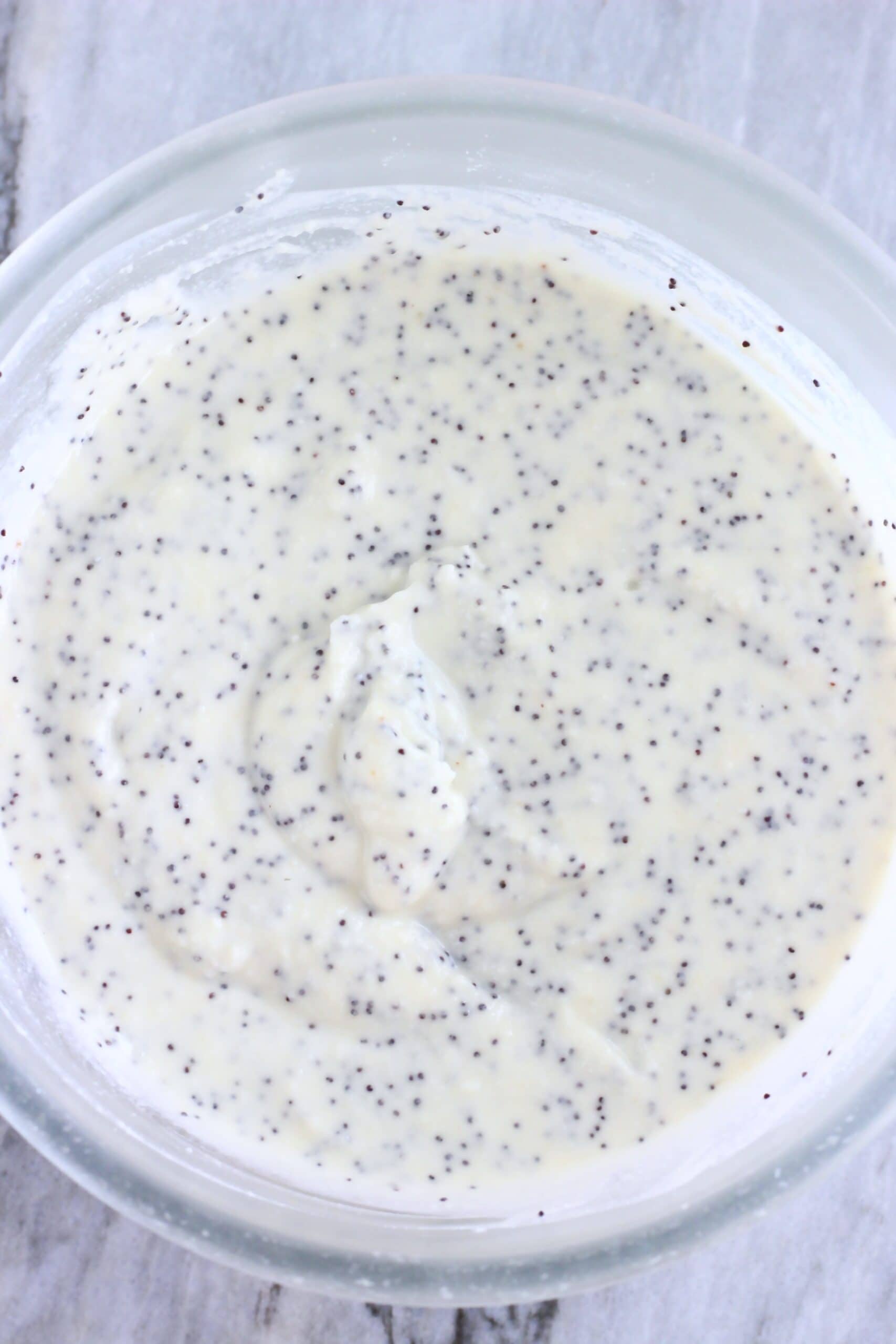 Raw gluten-free vegan lemon poppy seed pancakes batter in a bowl