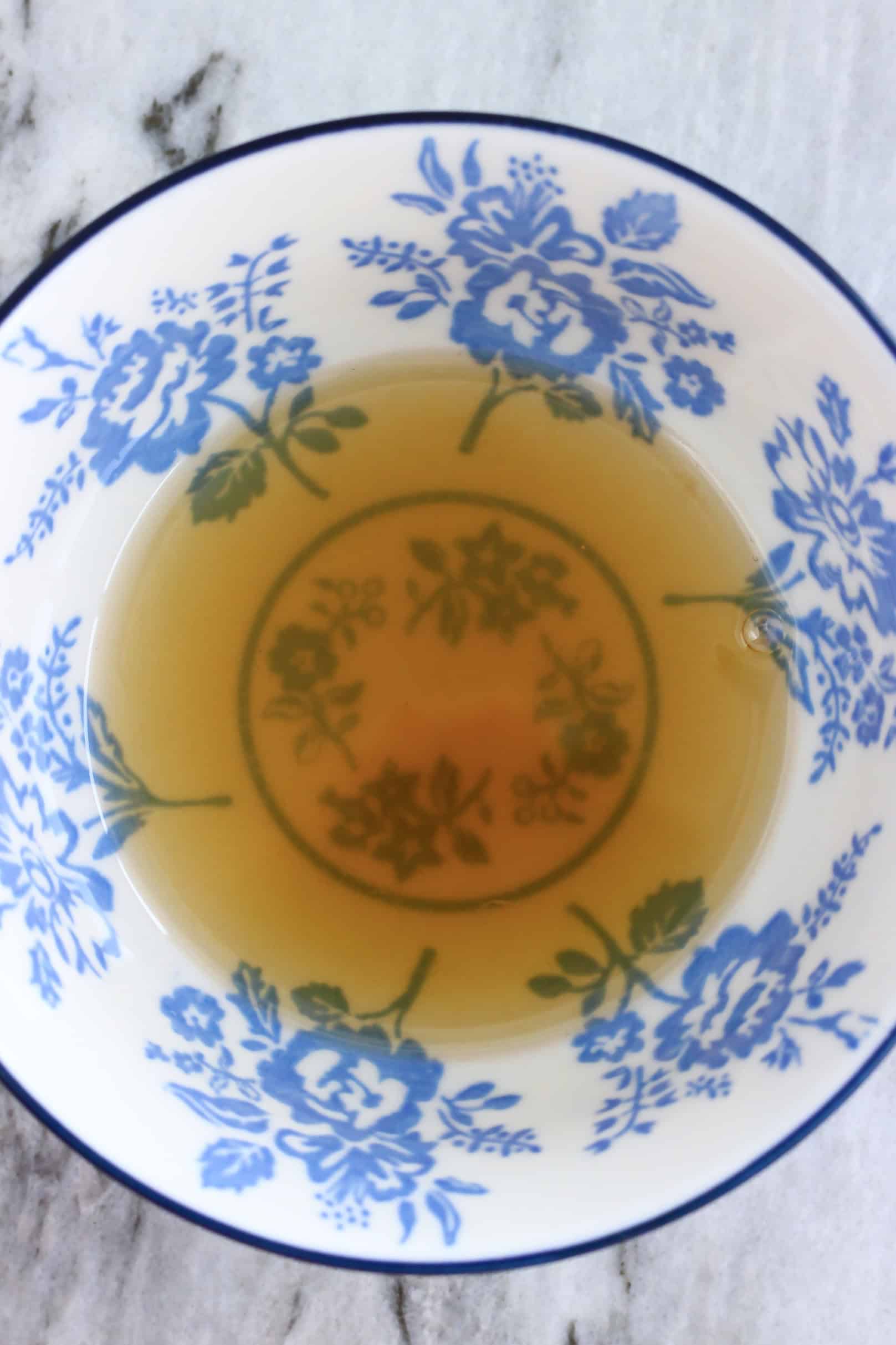 Lemon juice and maple syrup mixed together in a small bowl
