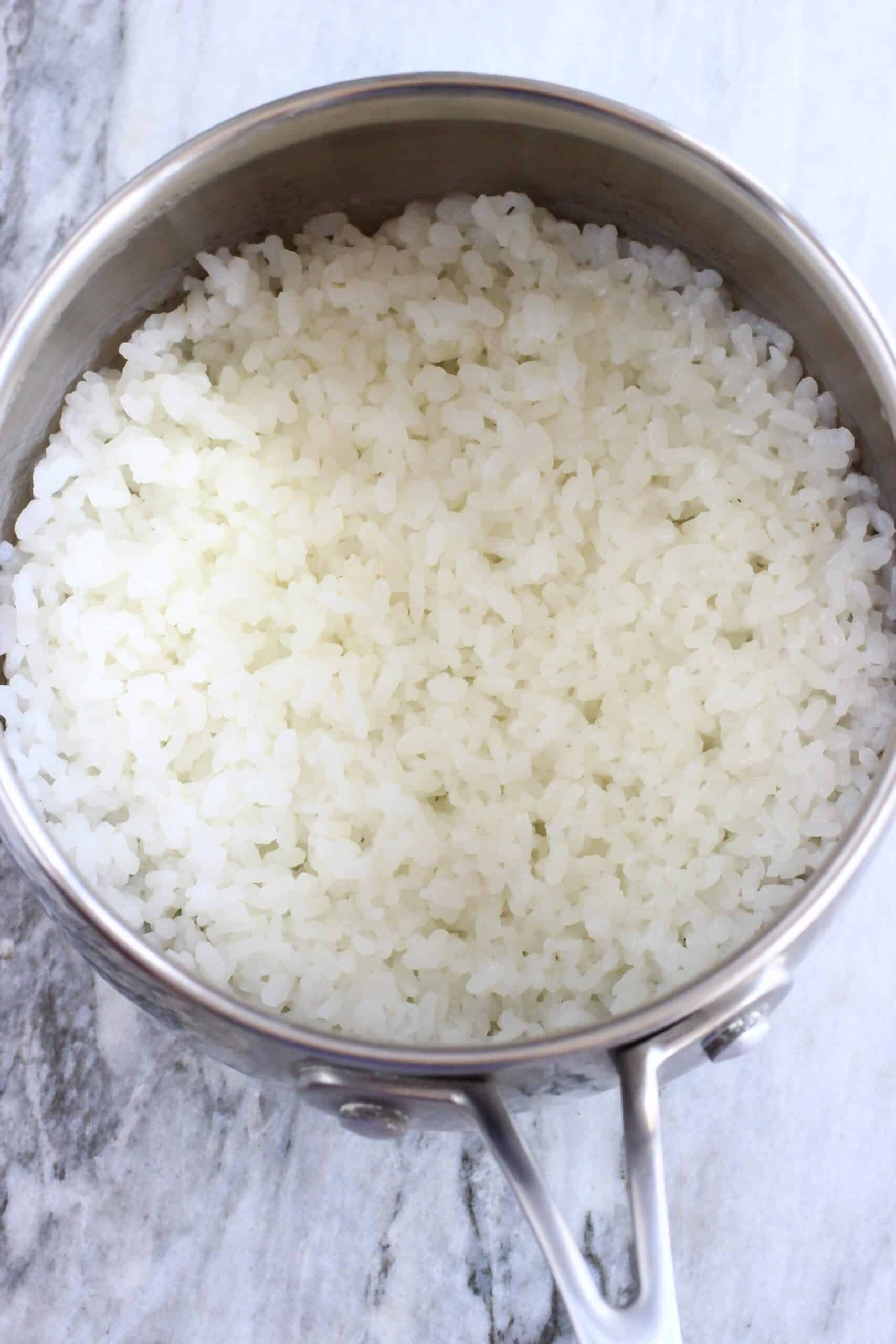Cooked white rice in a silver pan