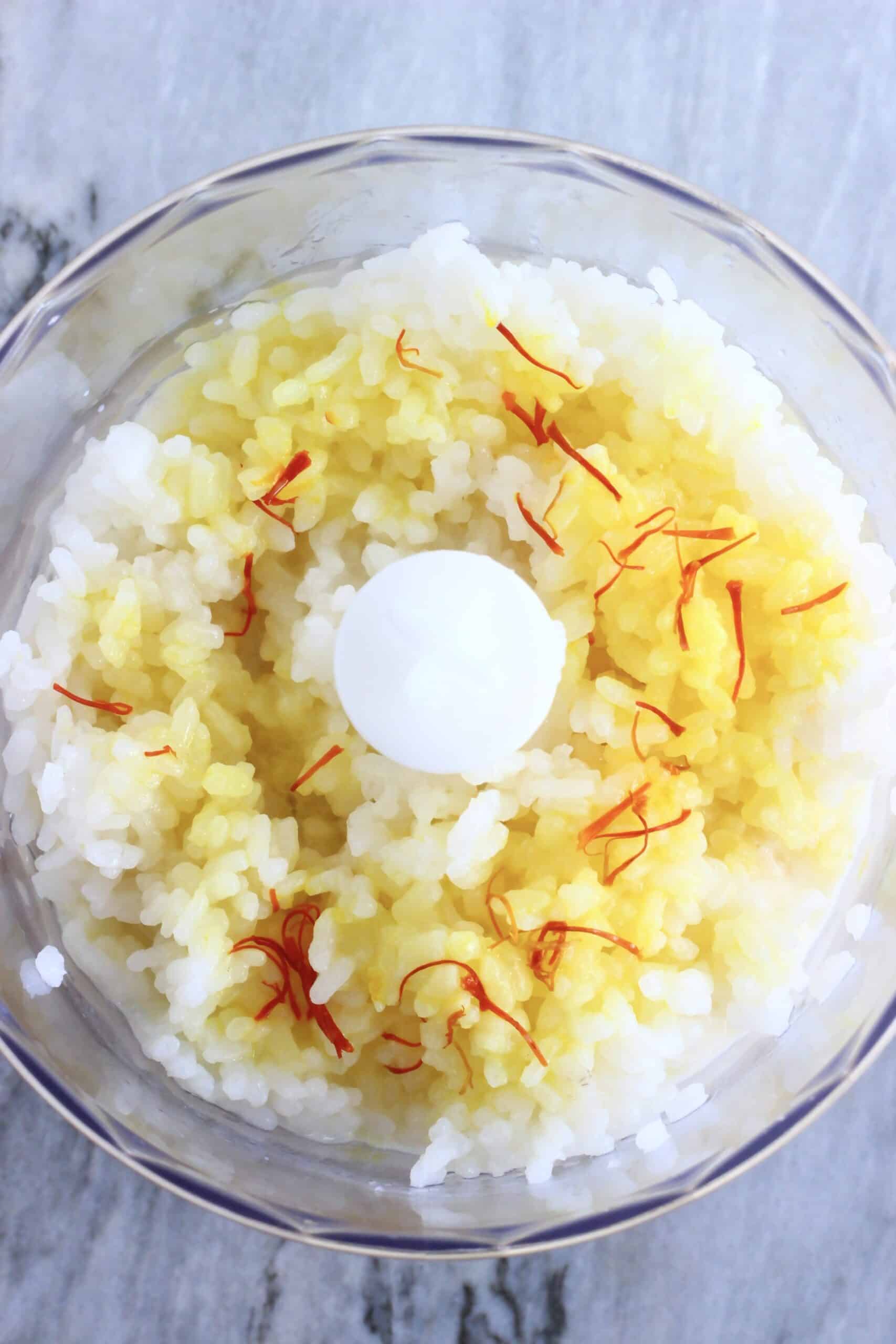 Cooked white rice, maple syrup, cacao butter and saffron in a food processor
