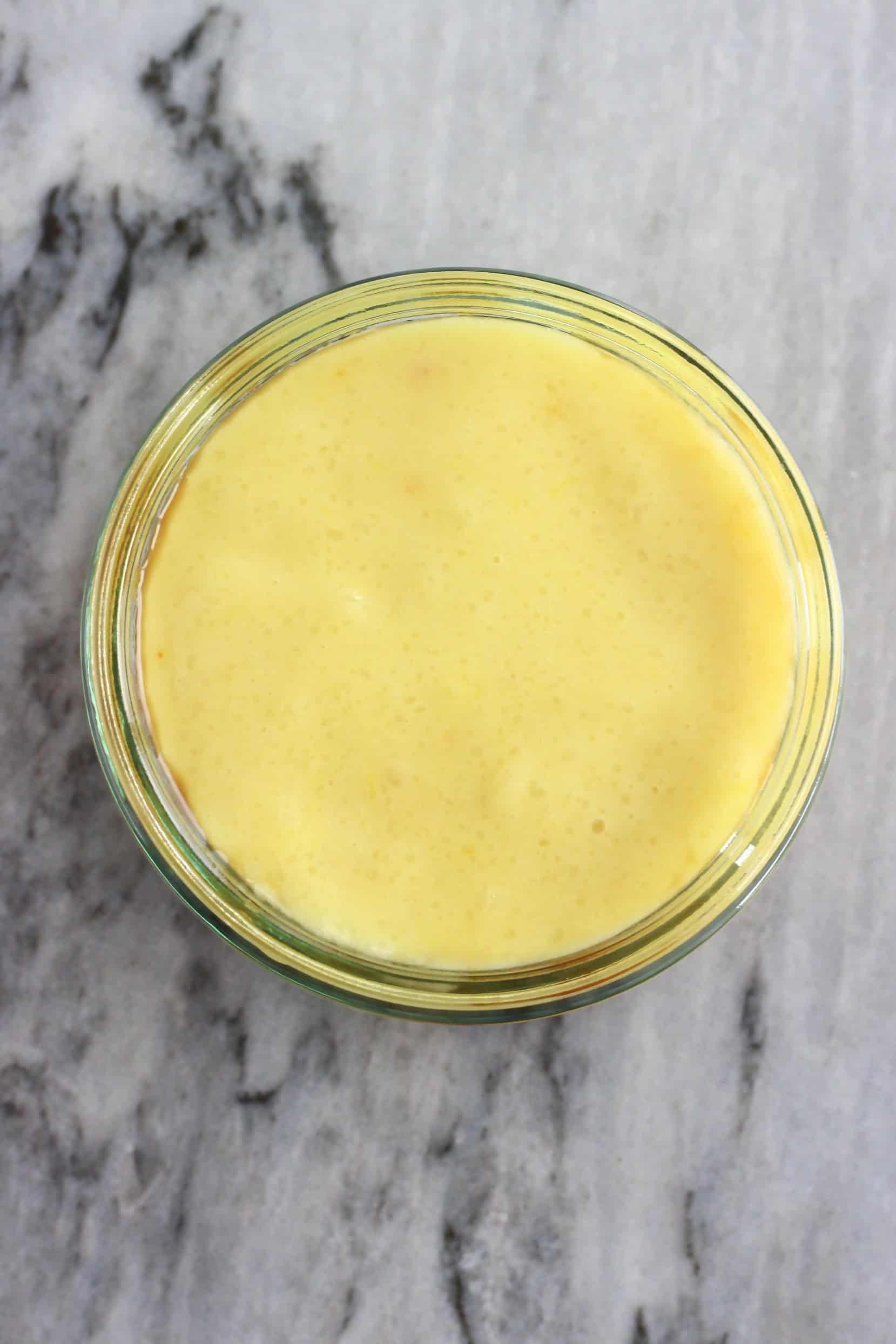 Vegan crème caramel mixture in a glass pot