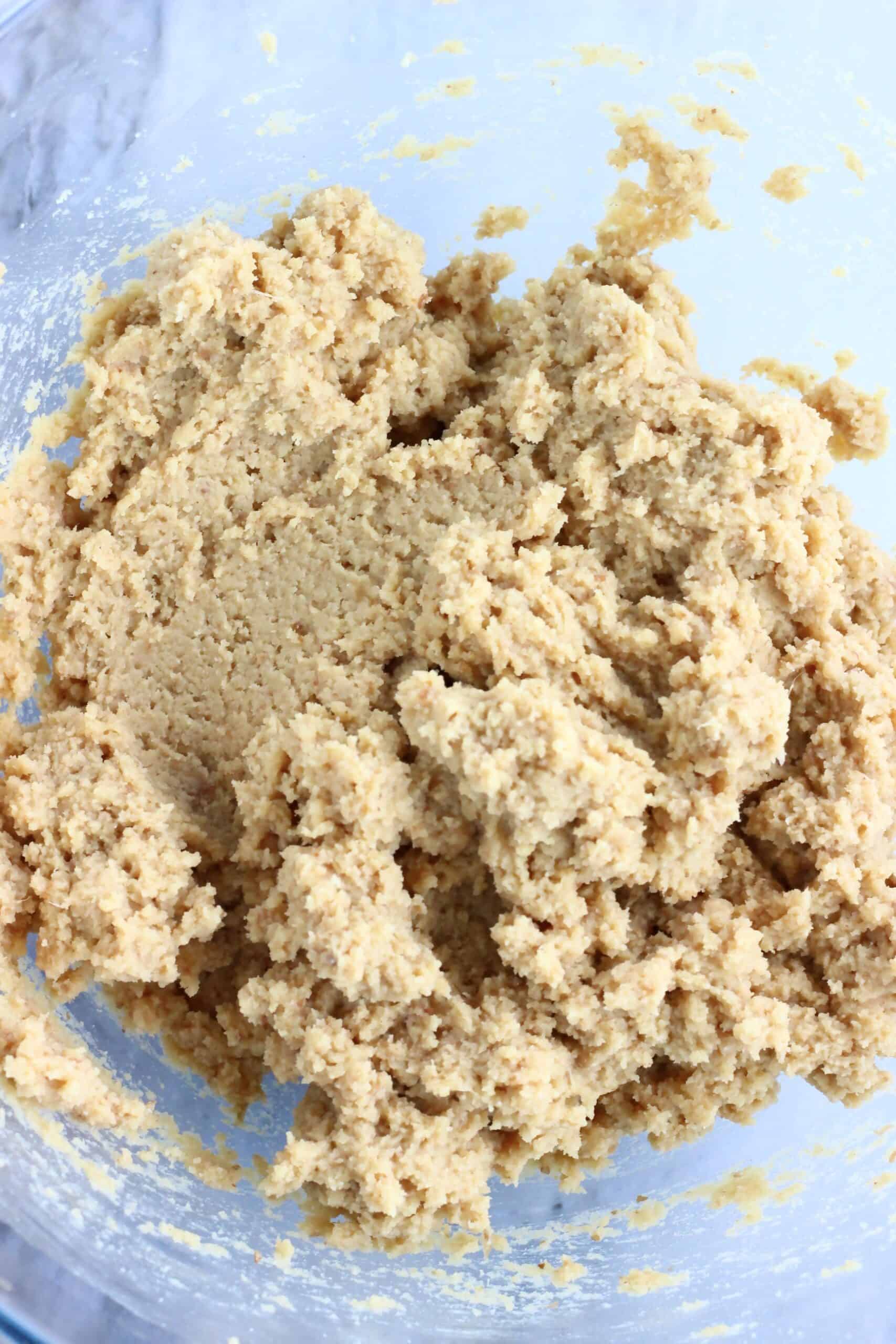 Raw chickpea cookies dough in a mixing bowl