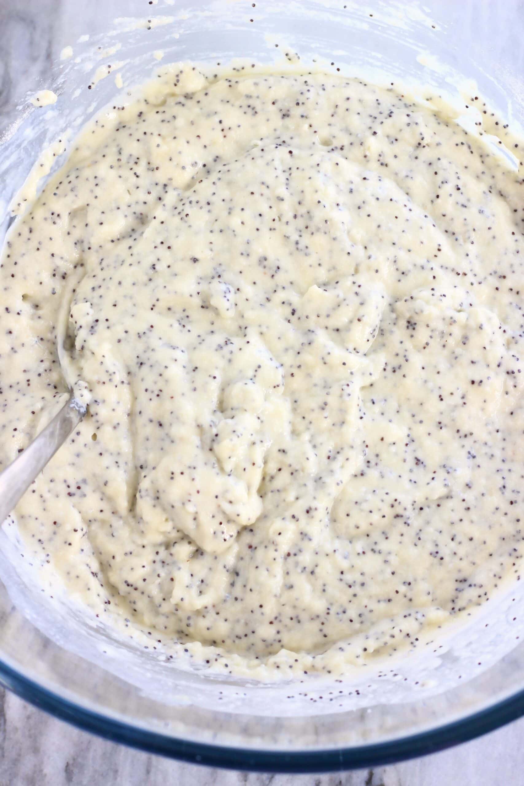 Raw vegan lemon poppy seed layer cake batter in a mixing bowl