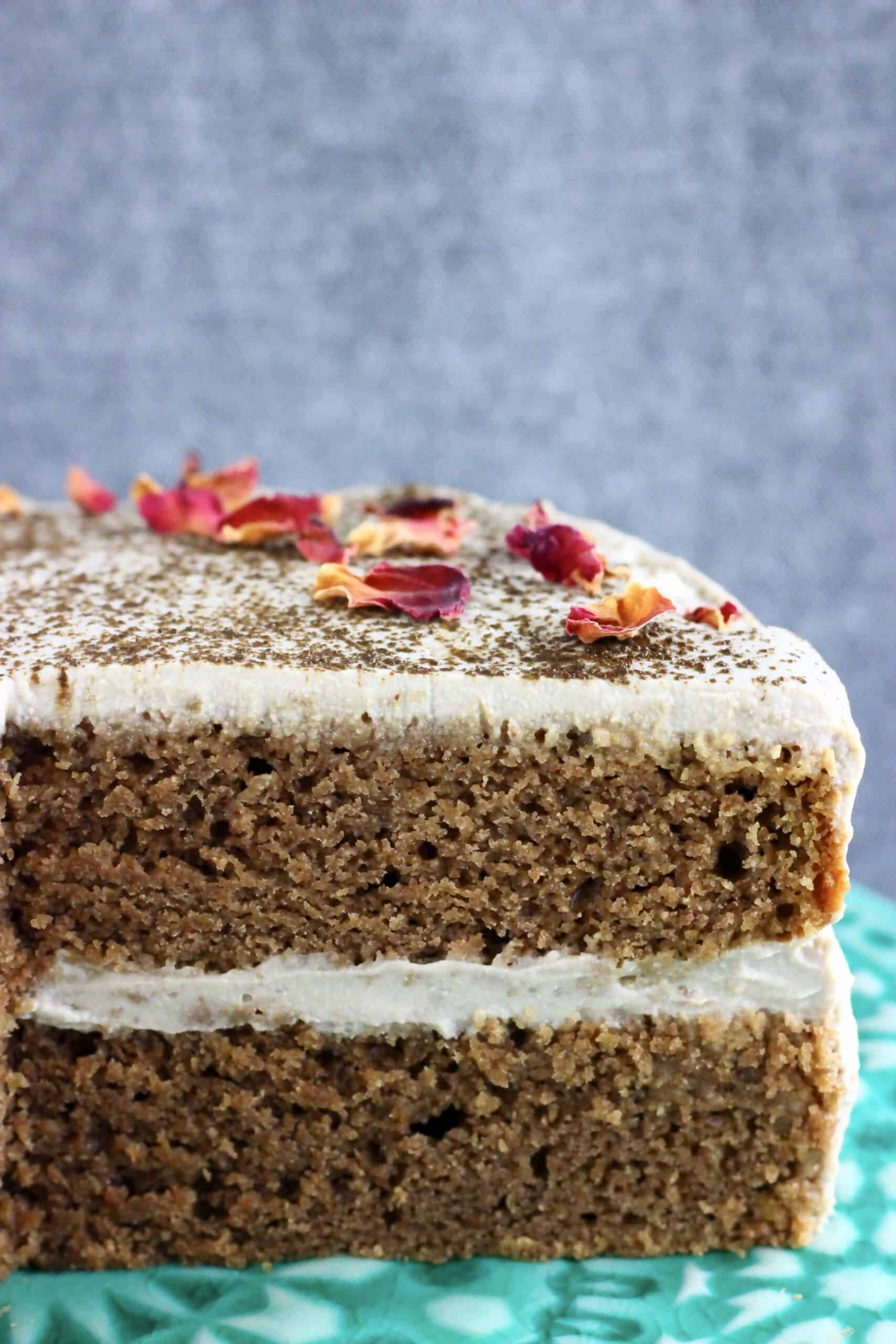 A sliced vegan hojicha latte cake on a cake stand