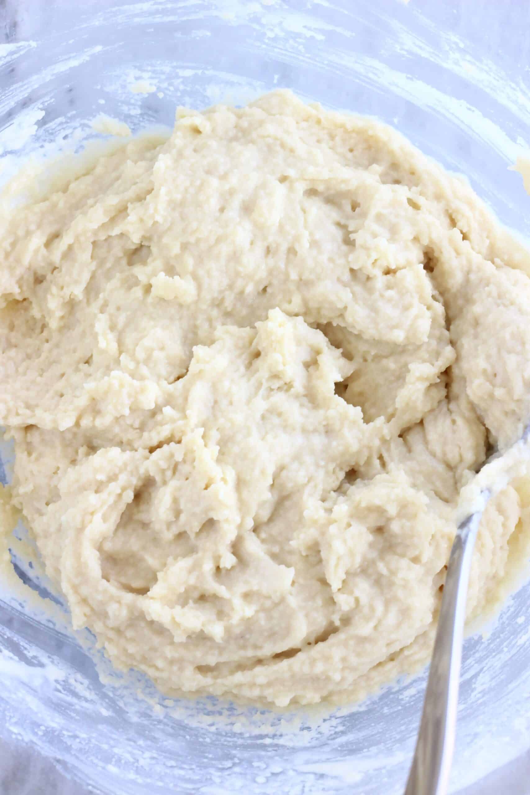 Raw gluten-free vegan apple cobbler dough batter in a mixing bowl
