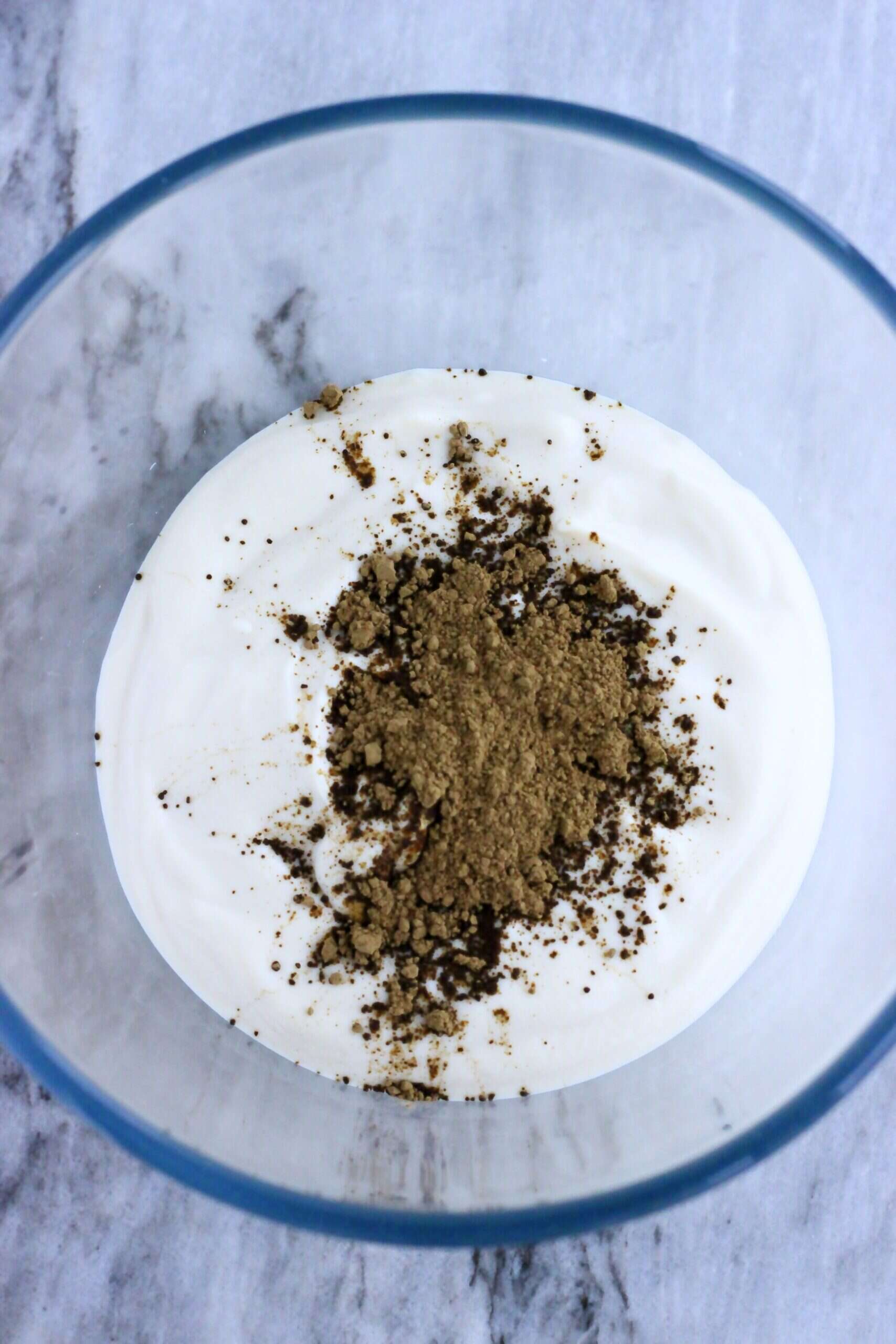 Vegan coconut whipped cream with hojicha powder in a bowl