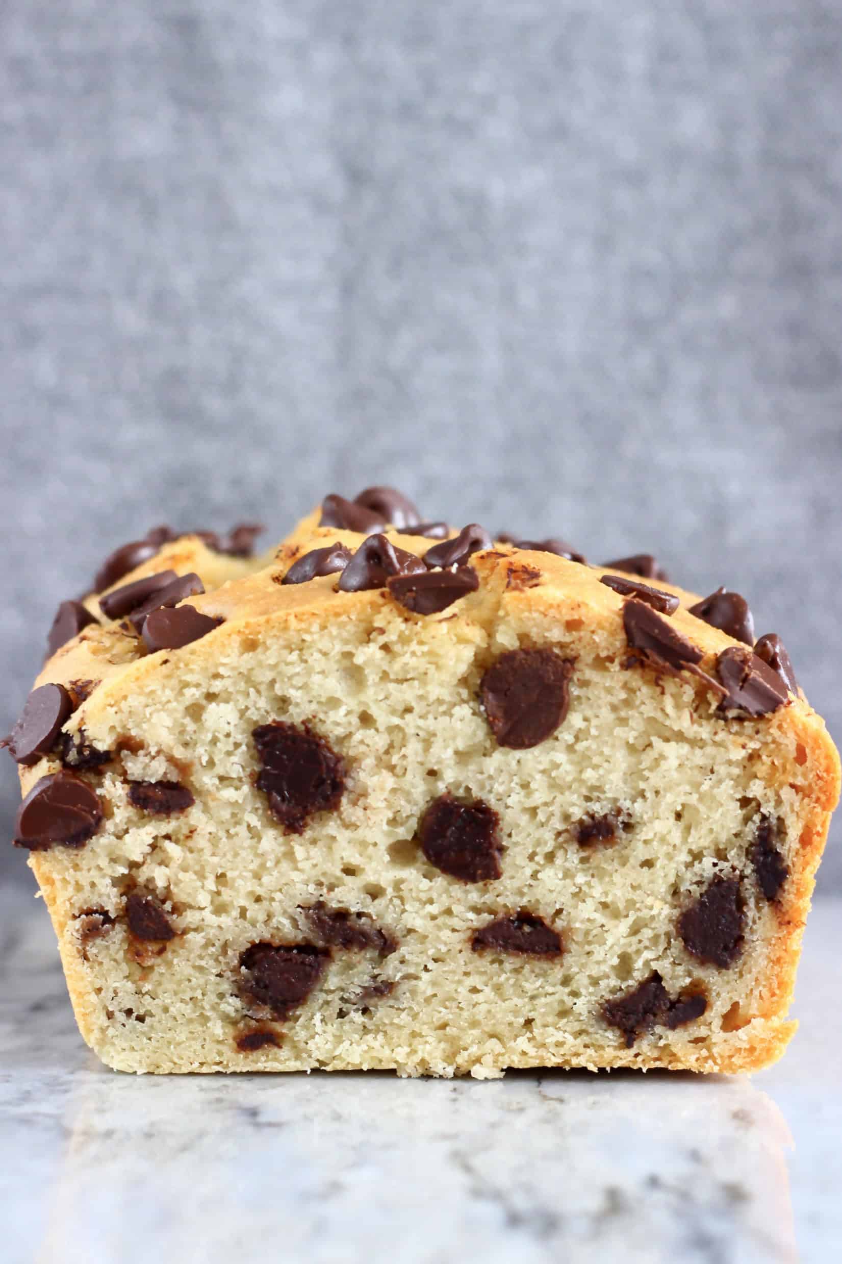 A cross-section of a sliced loaf of gluten-free vegan chocolate chip bread