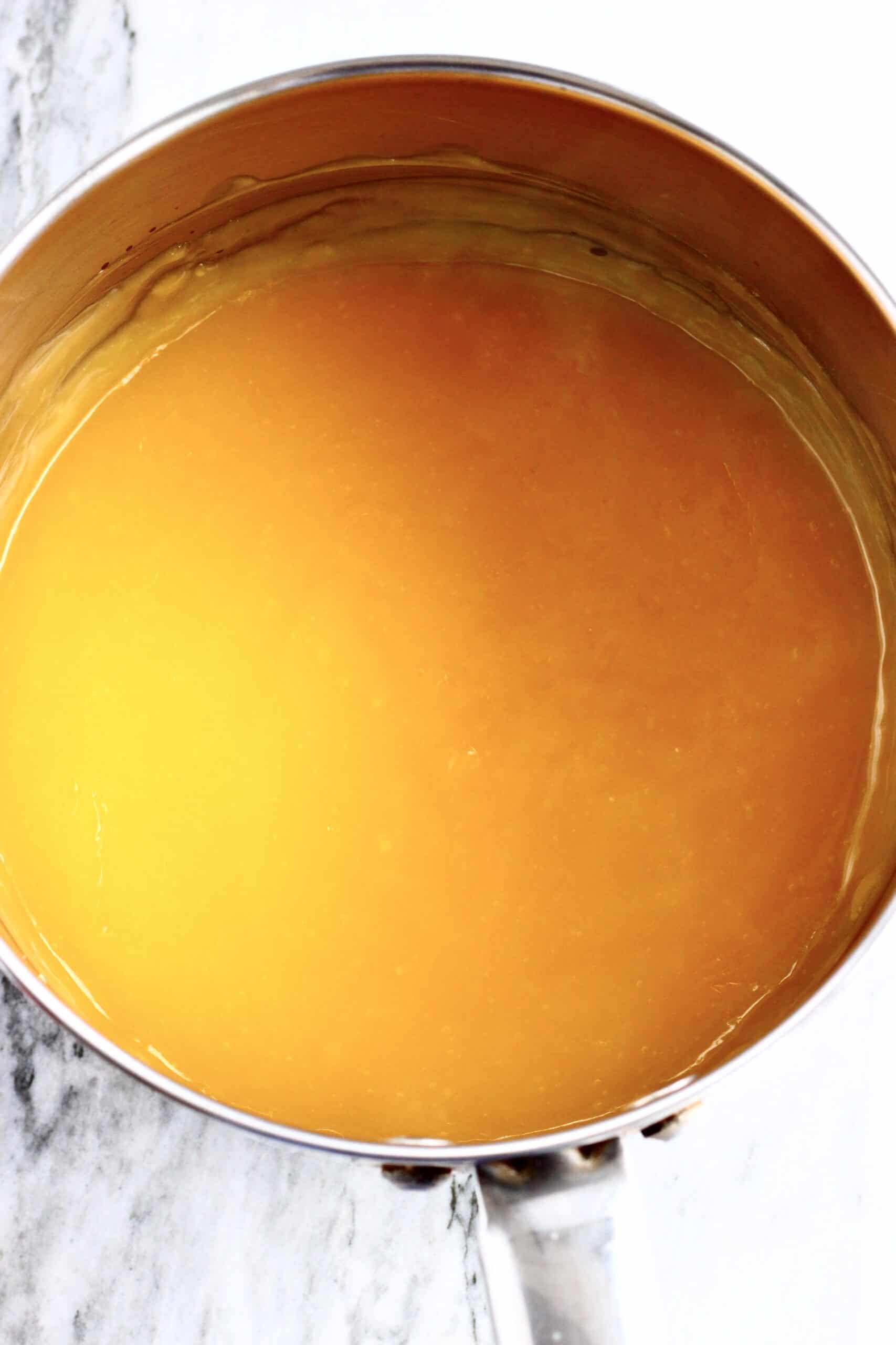 Vegan lemon sauce in a pan to make vegan lemon cobbler