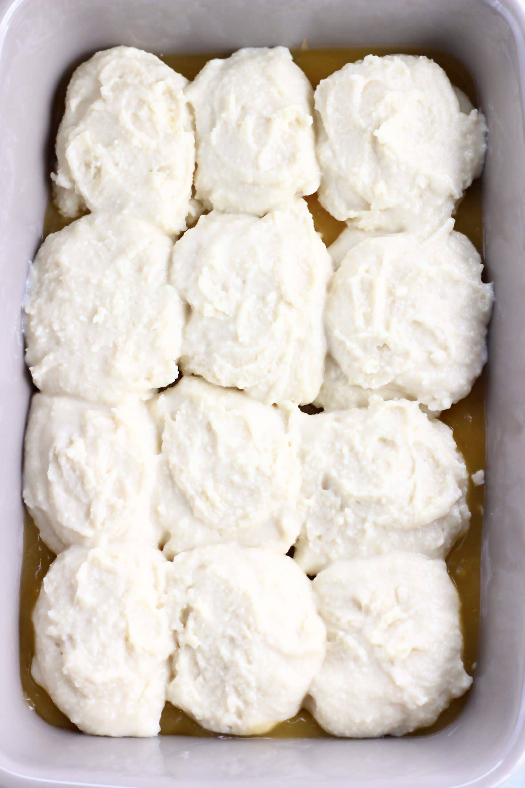 Raw vegan lemon cobbler in a rectangular baking dish