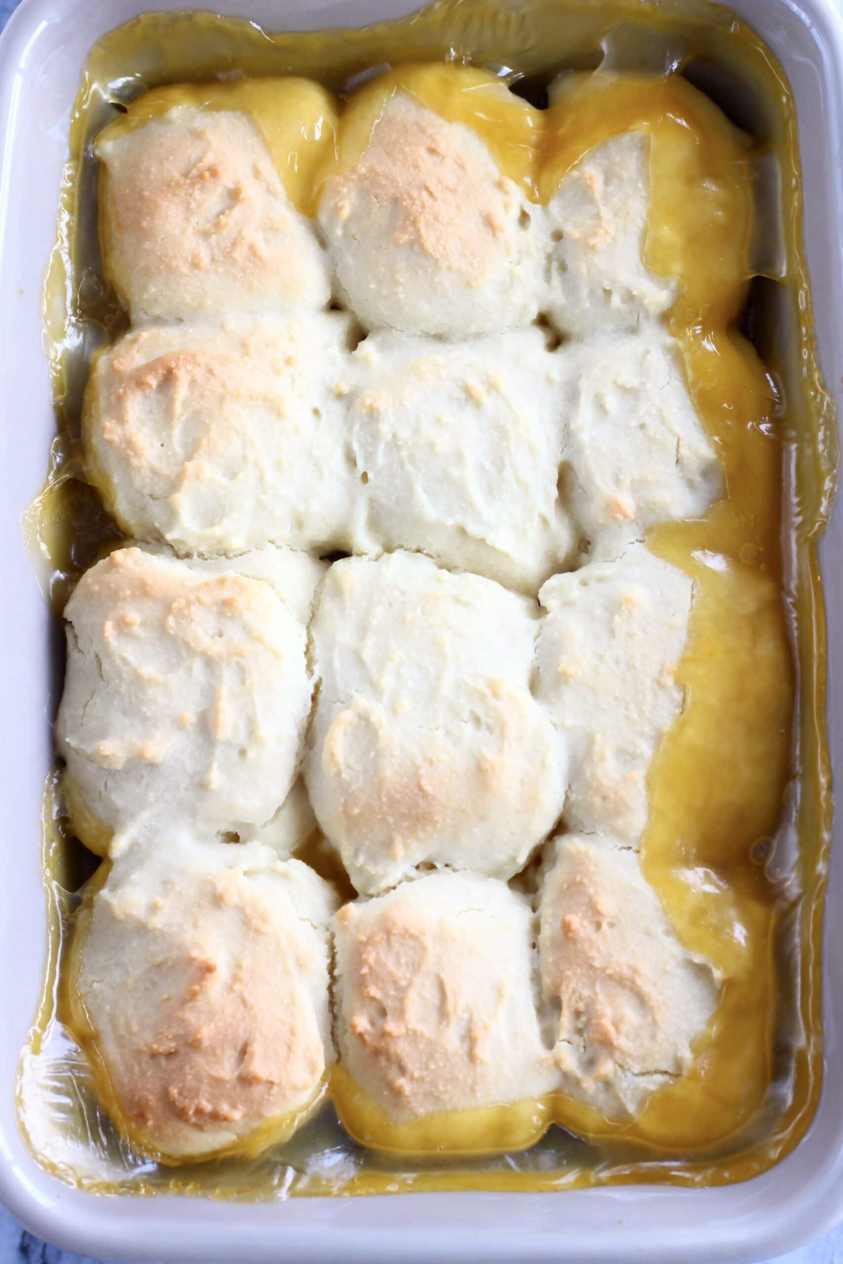 A baked vegan lemon cobbler in a rectangular baking dish