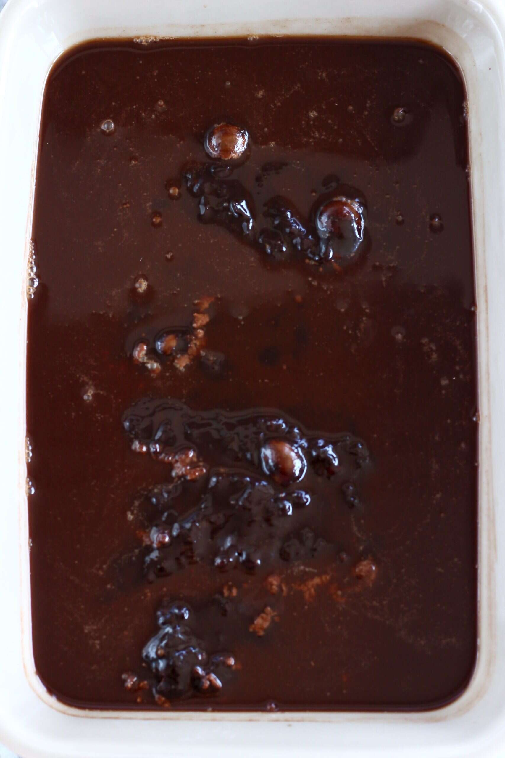 Raw vegan chocolate fudge pudding in a rectangular baking dish
