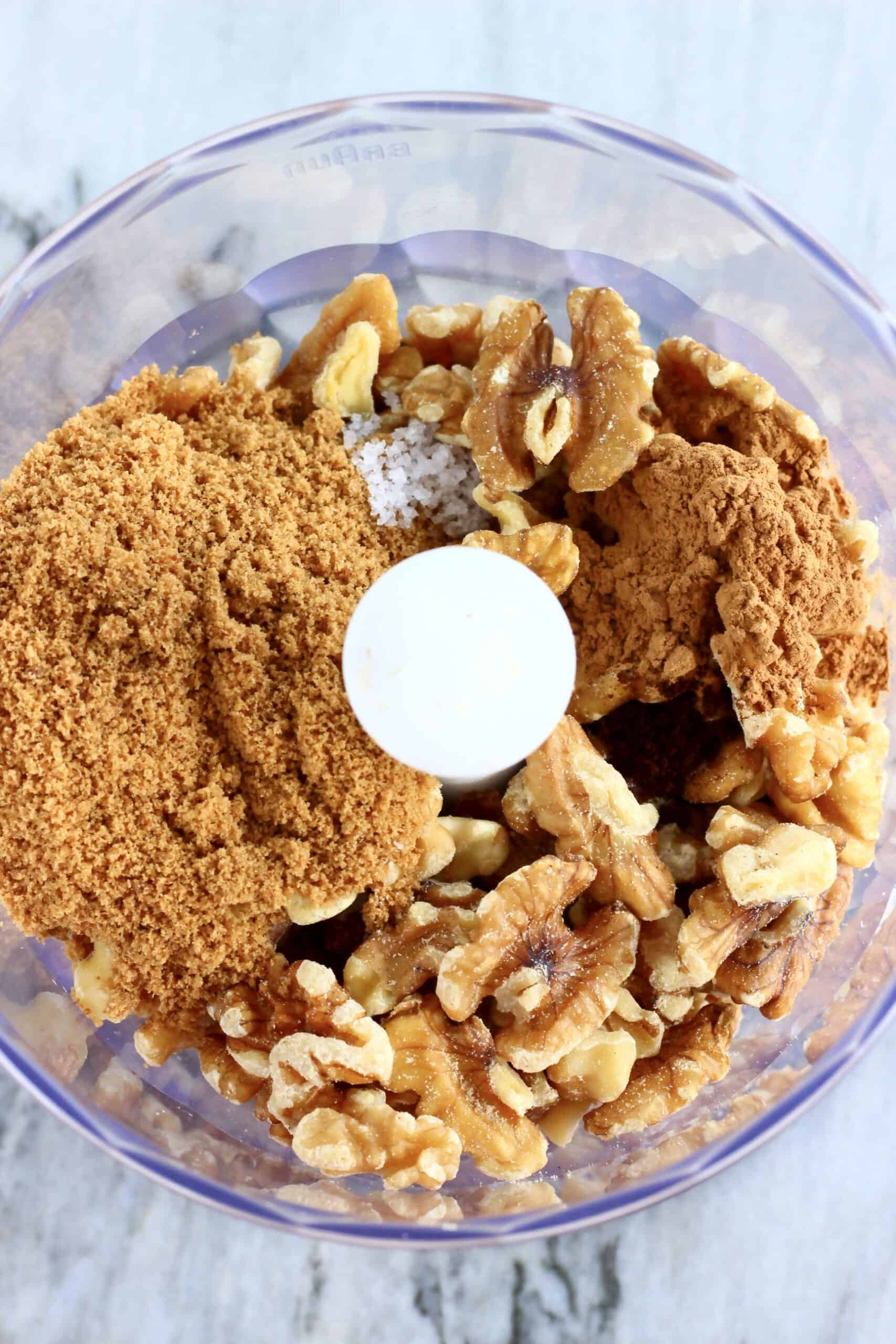 Walnuts and coconut sugar in a food processor