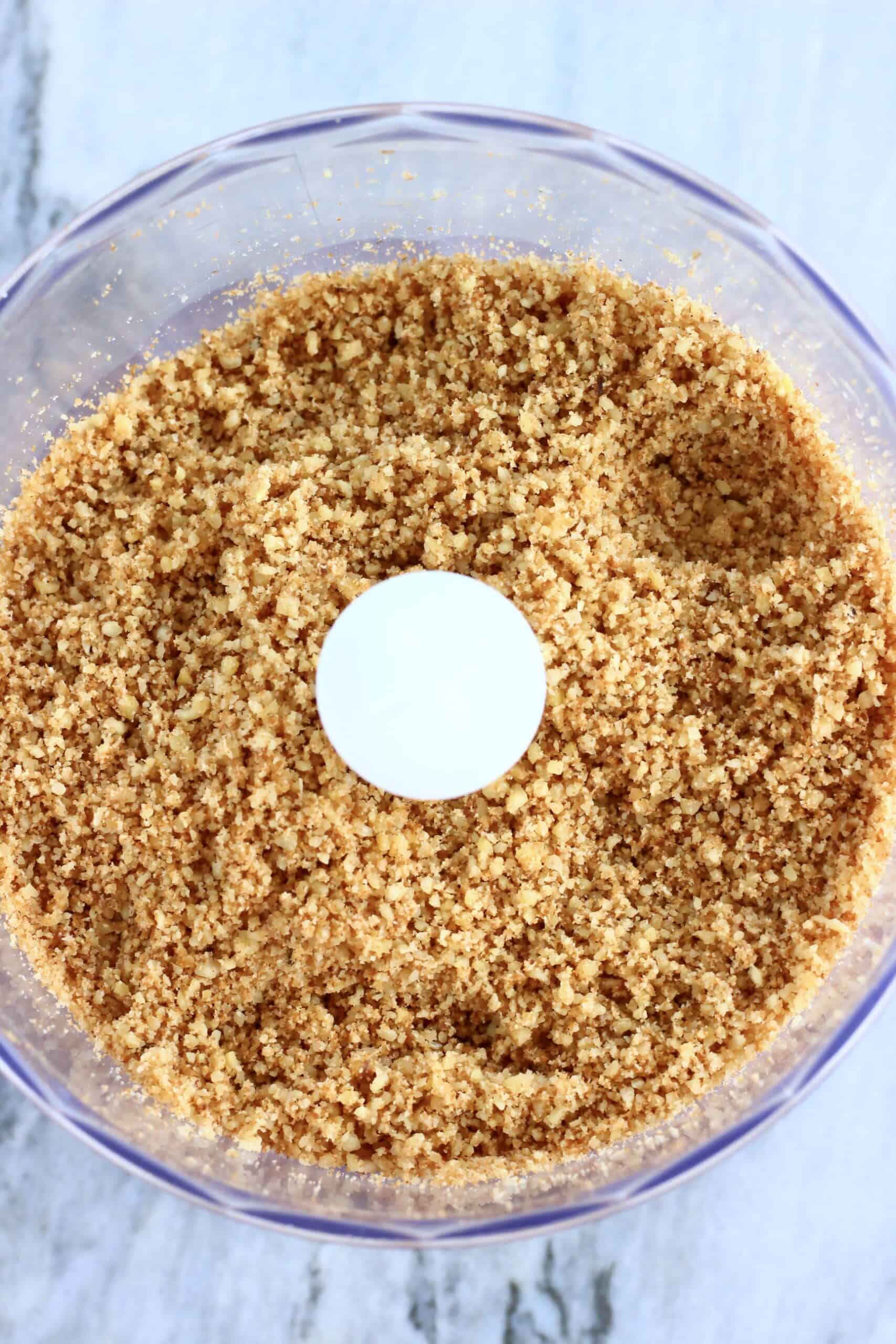 Ground walnuts and coconut sugar in a food processor