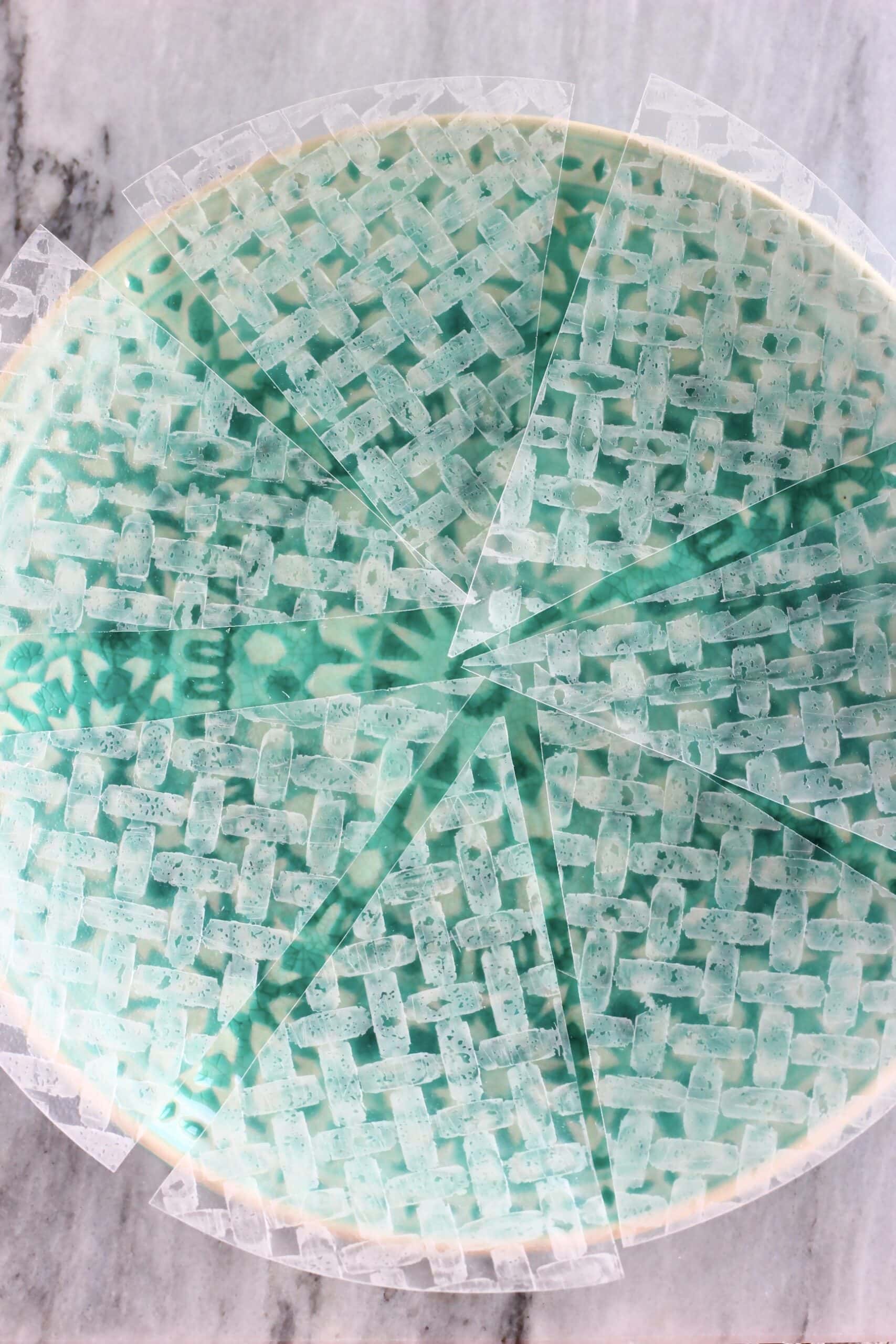 Rice paper sheets cut into eighths laid out on a plate