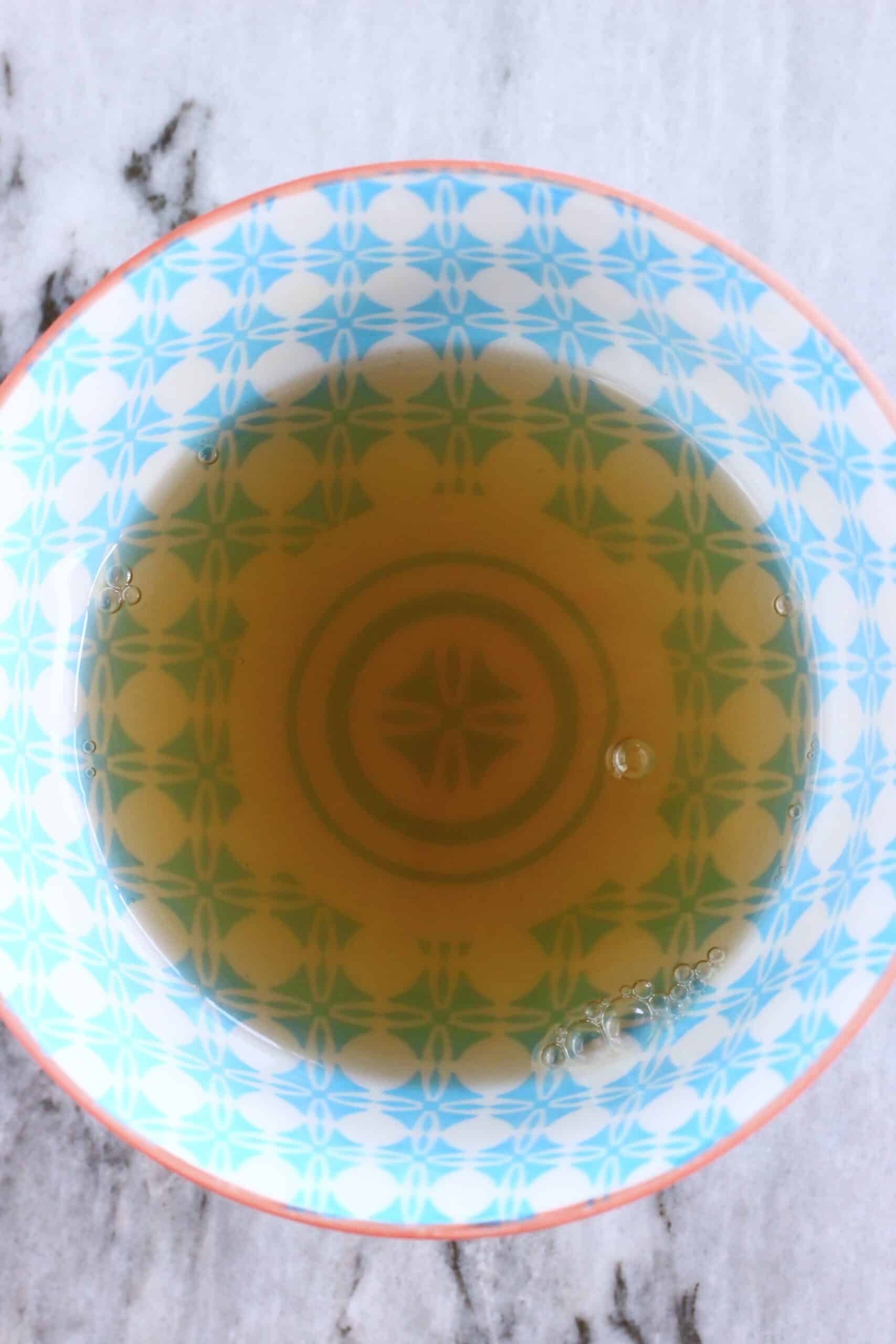 Agave syrup and hot water in a bowl