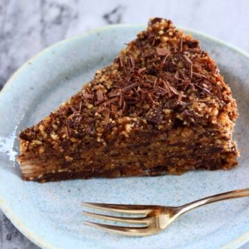 A slice of gluten-free vegan chocolate baklava on a plate with a fork