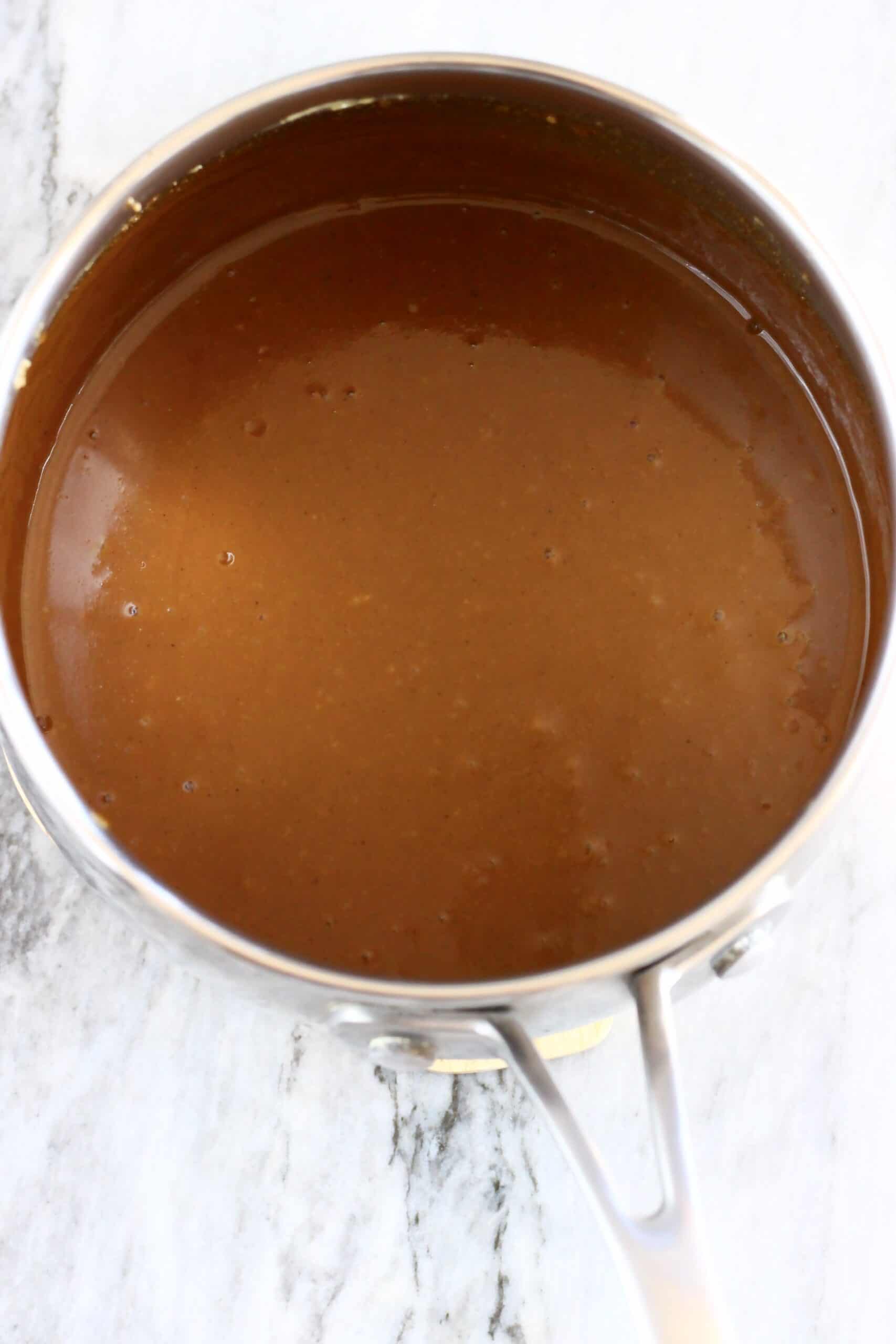 Vegan toffee sauce in a saucepan