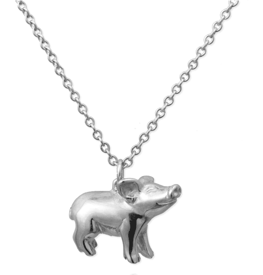 A silver Jana Reinhardt piglet necklace pendant on a chain