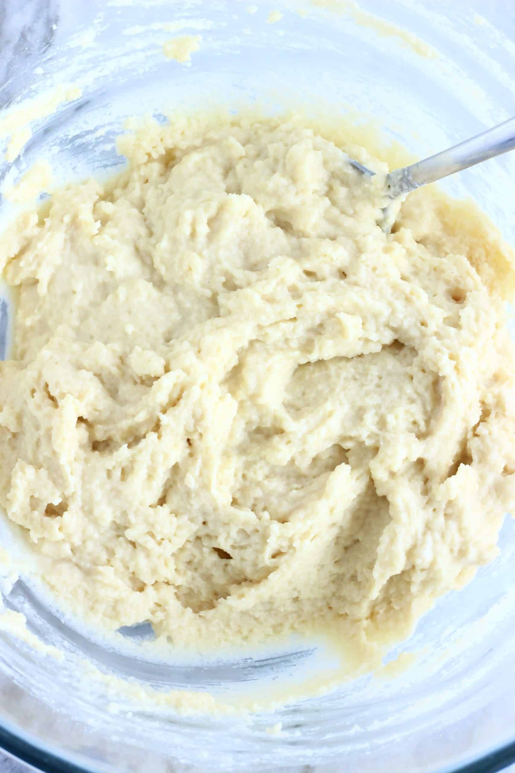 Vegan Honey Cake batter in a mixing bowl with a spoon
