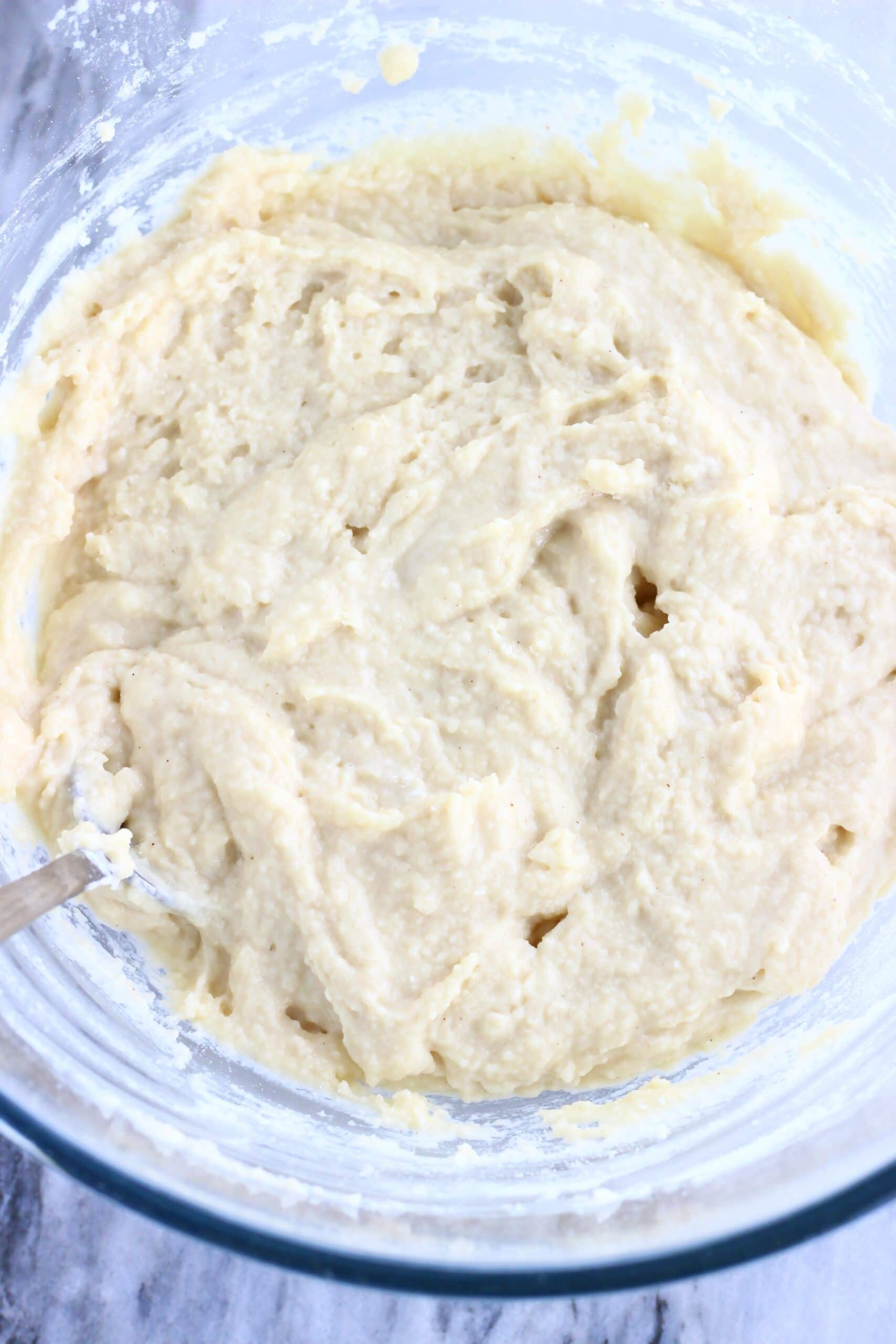 Raw Vegan Blueberry Cobbler dough in a bowl with a spoon